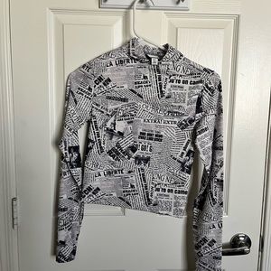 Crop newspaper print mock turtleneck. Super soft material stretchy.